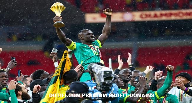 (FILES) Senegal's forward #10 Sadio Mane celebrates with the trophy after winning the Africa Cup of Nations (CAN) final football match against Morocco at the Prince Moulay Abdellah Stadium in Rabat on January 18, 2026. (Photo by FRANCK FIFE / AFP)