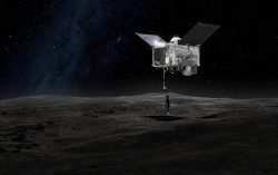 FILE - This artist's rendering made available by NASA on Sept. 6, 2016 depicts the OSIRIS-REx spacecraft contacting the asteroid Bennu with the Touch-And-Go Sample Arm Mechanism. On Wednesday, Oct. 12, 2023, NASA showed off the samples brought to Earth in September from the asteroid. (NASA/Goddard Space Flight Center via AP, File)